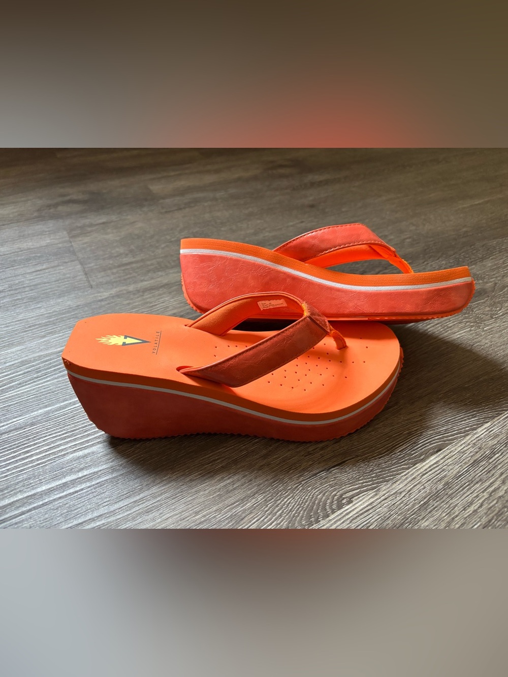 Volatile Coral-Orange Wedge Flip Flop Sandals
